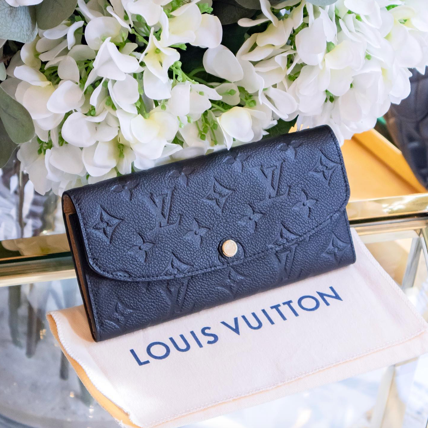 Louis Vuitton - Geldbörse mit Monogram Prägung