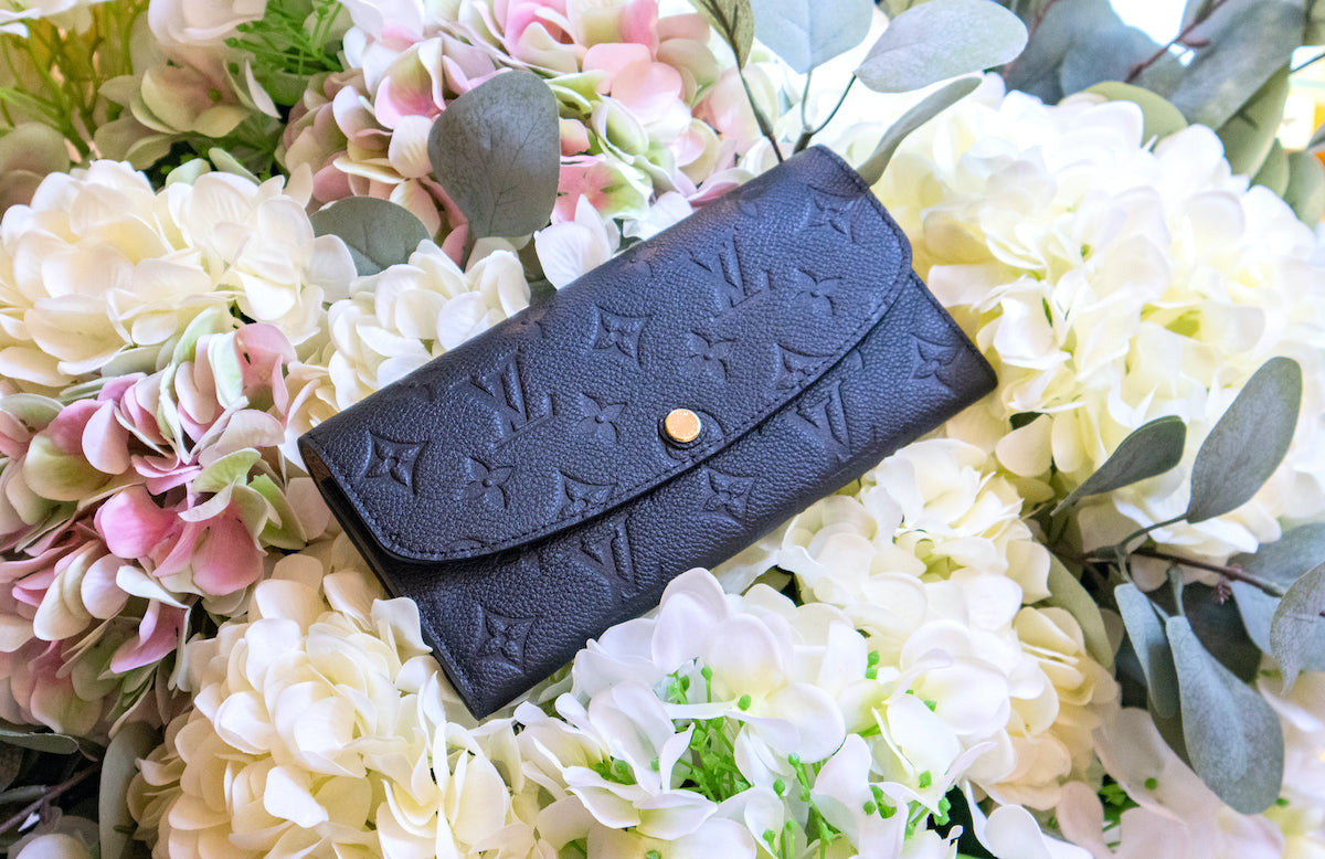 Louis Vuitton - Geldbörse mit Monogram Prägung